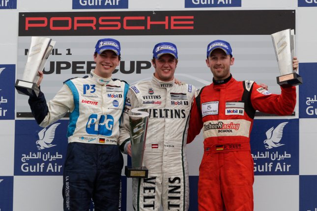 Podium Rennen 2: Christian Engelhart (D), Norbert Siedler (A), René Rast (D) Porsche Mobil 1 Supercup Bahrain 2012