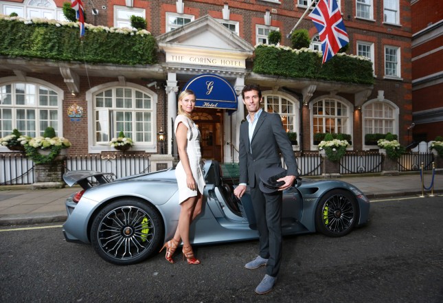 French Open winner, Maria Sharapova, is picked up from The Goring hotel in Central London by Porsche Works Driver and ‘world’s fastest chauffeur’ Mark Webber, in the plug-in hybrid Porsche 918 Spyder and driven to the Women's Tennis Association (WTA) Pre-Wimbledon Party at the Kensington Roof Gardens.  Photo. Picture date: Thursday June 19, 2014. Hitting 0-60 mph in 2.5 seconds and with a top speed of 214 mph, the 918 Spyder is the most powerful road car Porsche has built to date, yet is exempt from the Congestion Charge as the plug-in hybrid super sports car emits less CO2 than most small cars and many other hybrid vehicles. Photo credit  should read: Matt Alexander/PA Wire
